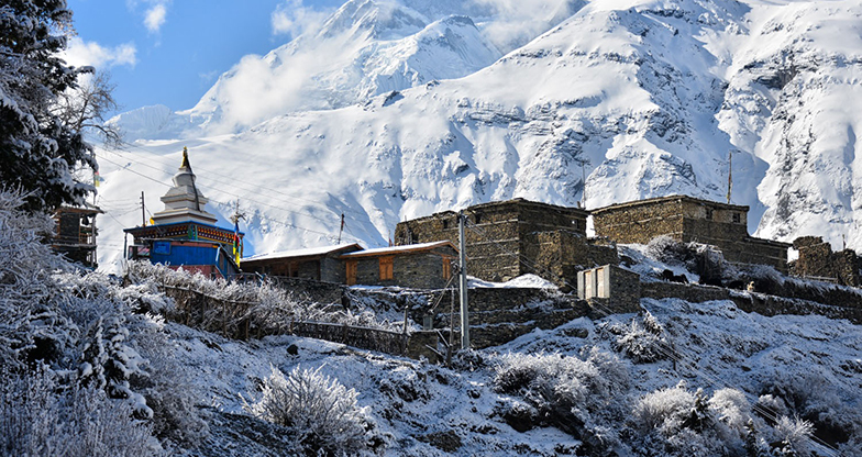 Snowy peaks and villages covered in snow from Nar Phu Valley