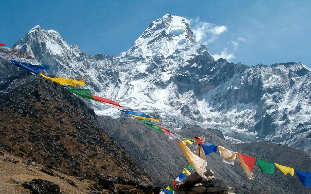 prayer flags and mountains seen during the Helambu Trek