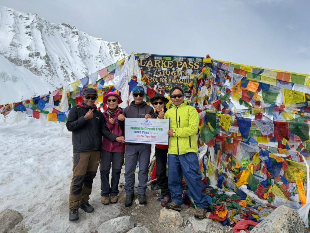 Trekkers celebrating at Larke Pass 5106 meters on Manaslu Circuit Trek
