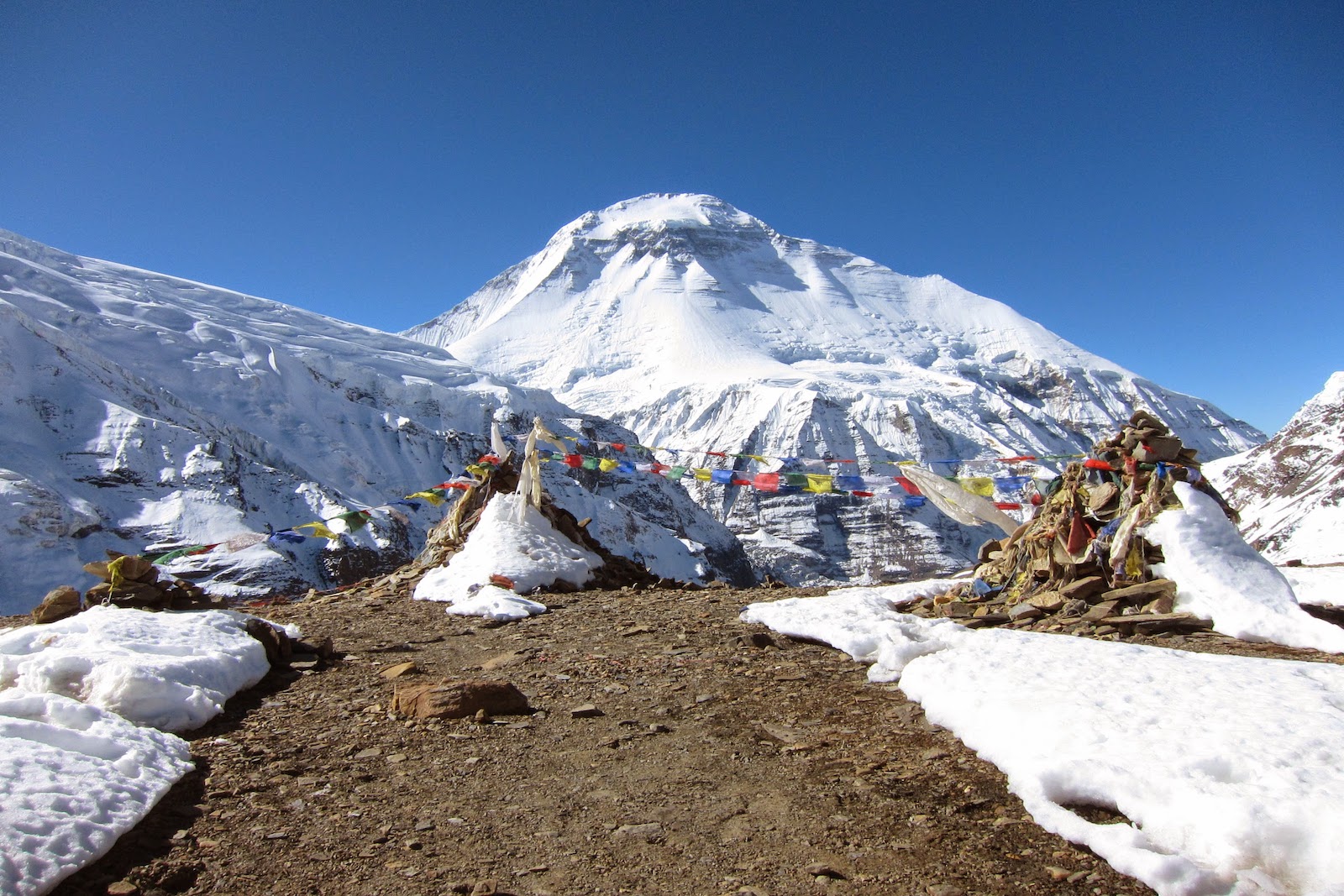 Dhaulagiri peak with prayer flags on Dhaulagiri Circuit Trek Nepal