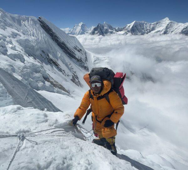 Climber above the clouds during Annapurna I ascent Spring 2026