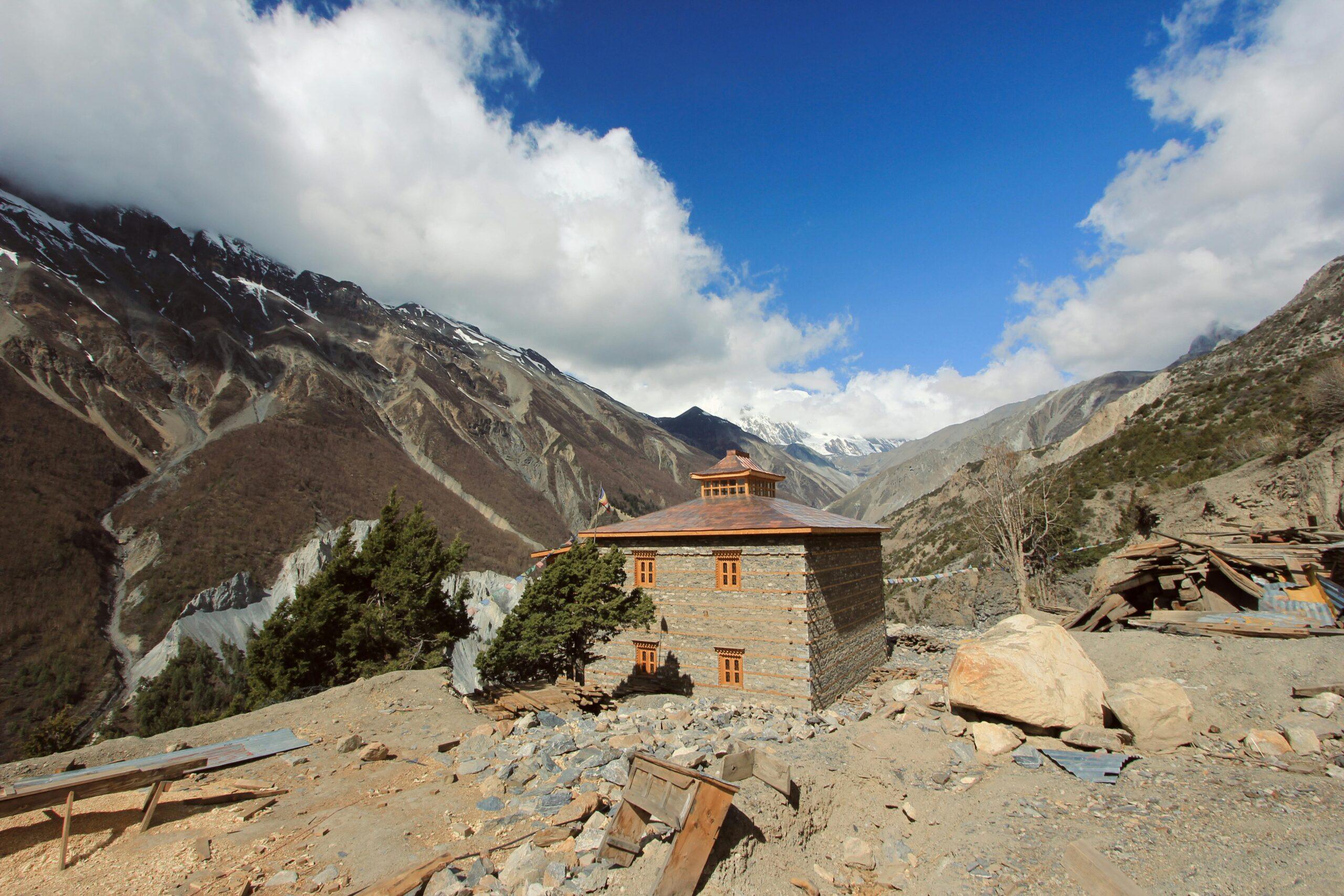Ancient stone structure on Lower Dolpo Trek with mountain view